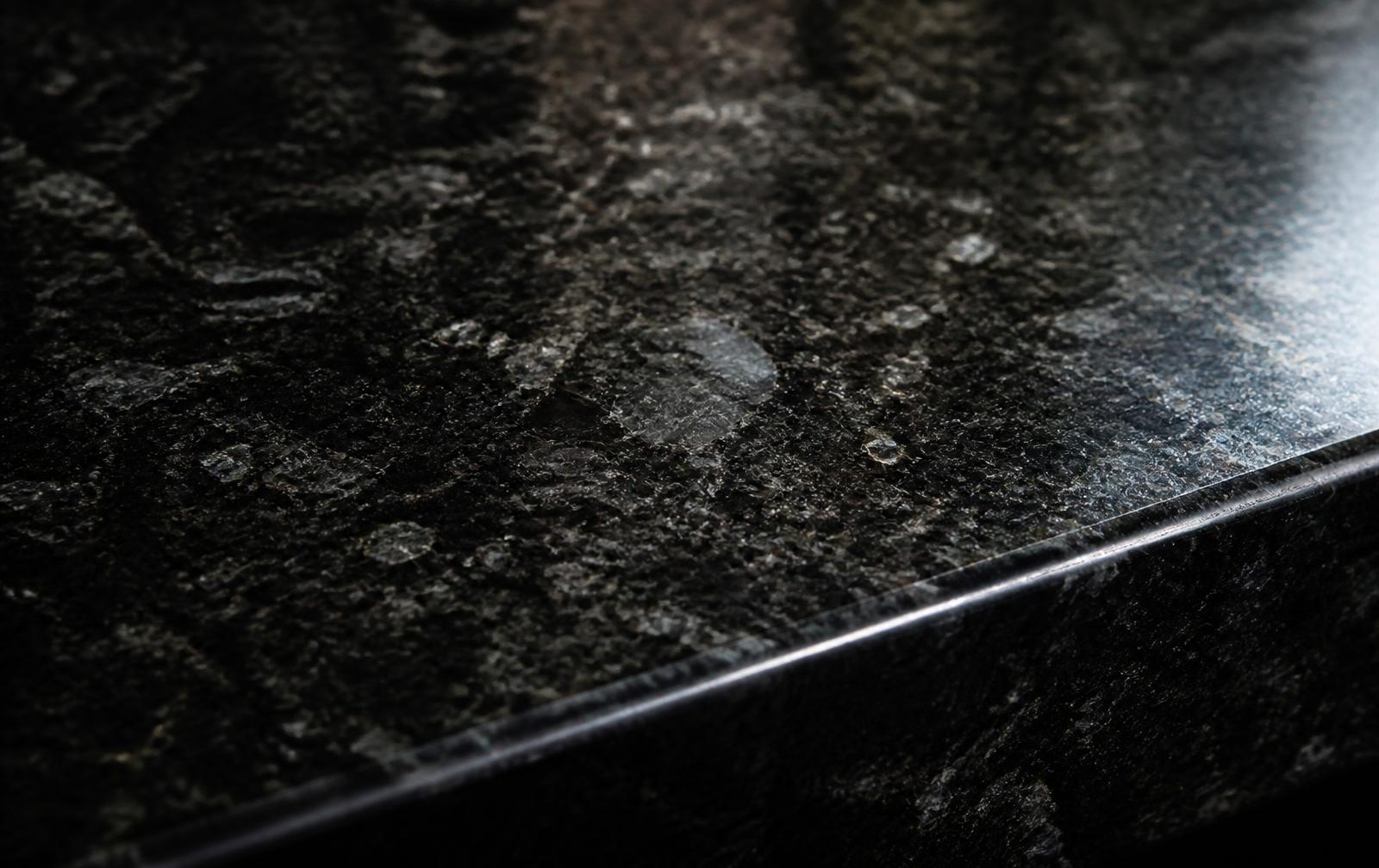 Polished black granite slab edge